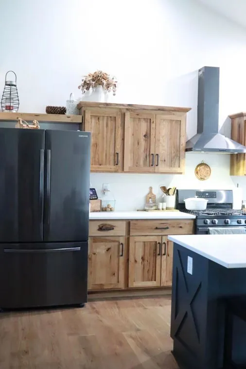 Hickory uppers and a custom range hood surround — built by Amish Heritage Woodworks, Wisconsin