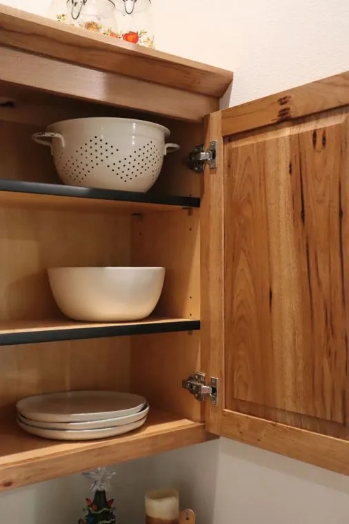 Inside a hickory cabinet — solid wood construction and adjustable shelving — built by Amish Heritage Woodworks, Wisconsin